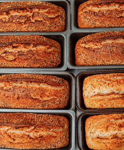 Freshly baked bread in molds on the table in bakery