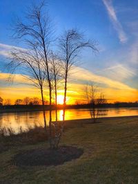 Scenic view of lake against sky during sunset