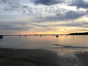 Scenic view of beach against sky during sunset