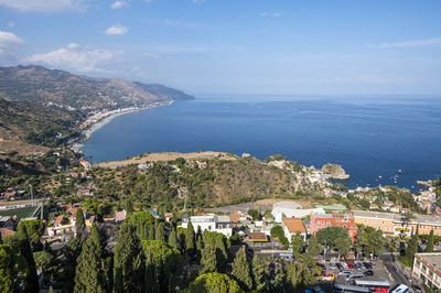 Aerial wide angle view of taormina and its beautiful coastline