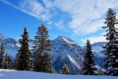 Scenic view of snow covered mountains sky