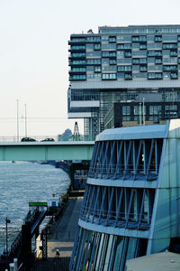 Tilt image of modern buildings against sky in city