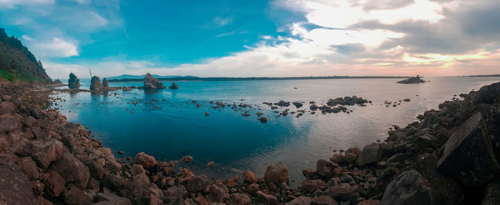 Panoramic view of sea against cloudy sky