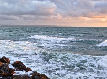 Scenic view of sea against sky during sunset