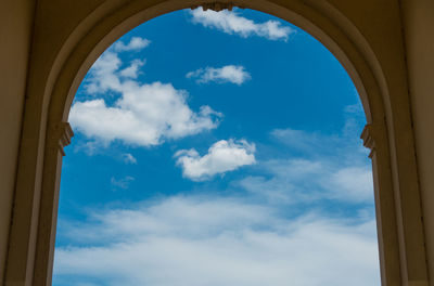Low angle view of blue sky seen through clouds