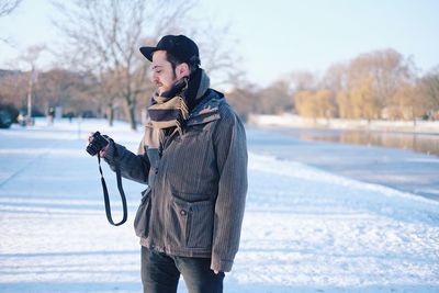 Man wearing hat on snow