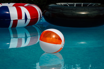 Close-up of red floating on swimming pool