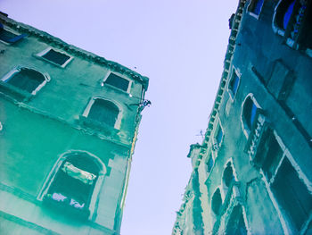 Low angle view of building against clear blue sky