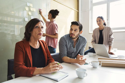 Business people having discussion at conference table