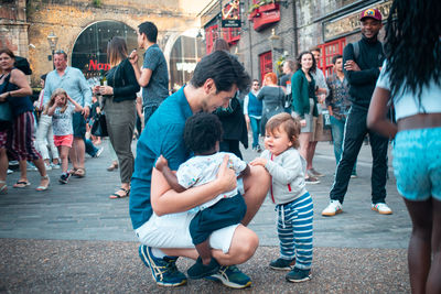 Group of people on street in city