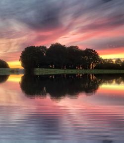 Scenic view of lake against sky during sunset