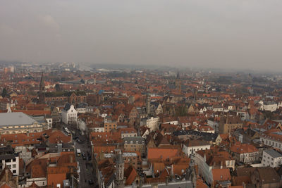 Aerial view of cityscape against sky