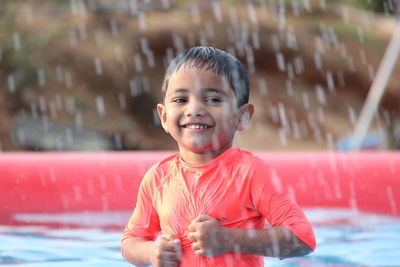 Smiling boy in swimming pool