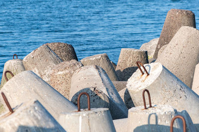 Close-up of old rusty container on beach