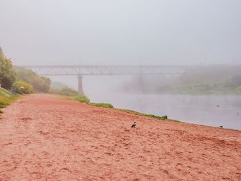 View of bridge over lake against sky