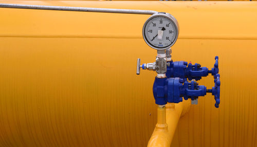 Close-up of machine valve with gauge