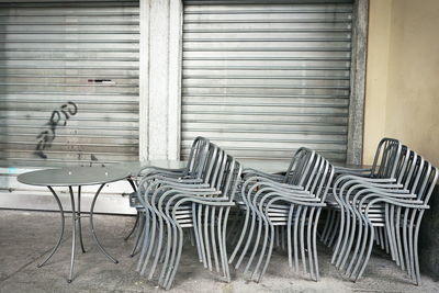 Empty chairs and tables in building