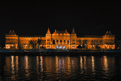 Illuminated buildings in city at night