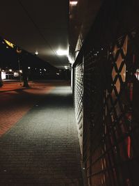 Illuminated underground walkway at night