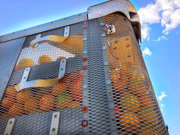 Low angle view of metal structure against sky