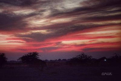 Scenic view of dramatic sky during sunset