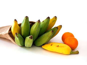 Close-up of fruits against white background