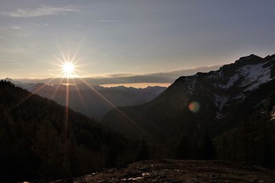 Scenic view of mountains against sky during sunset