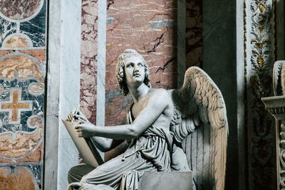 Statue of angel outside historic building