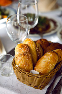 Fresh baked bread is in the basket on the holiday table