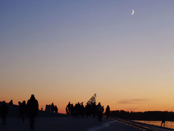 View of landscape against clear sky at sunset