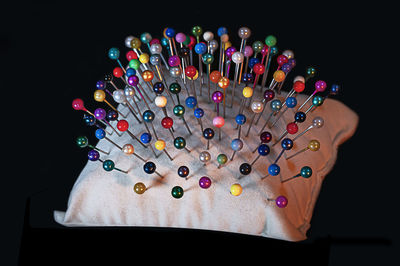 High angle view of multi colored pencils on table against black background