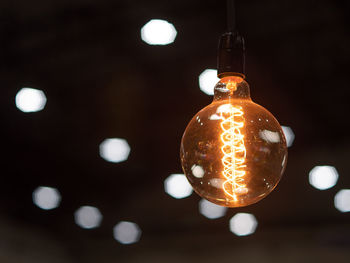 Low angle view of illuminated light bulb