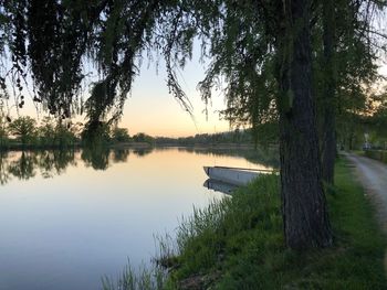 Scenic view of lake against sky during sunset