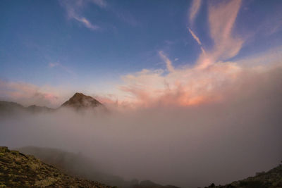 Scenic view of mountains against sky during sunset