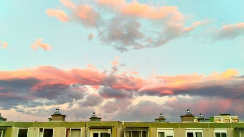 High section of buildings against sky during sunset