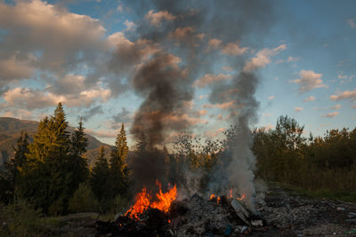 Panoramic view of bonfire against sky