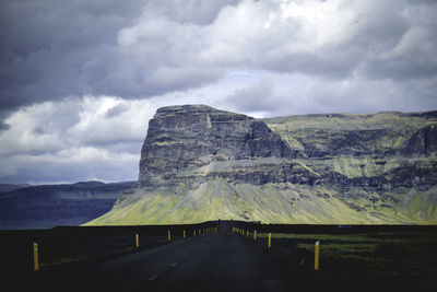 Scenic view of landscape against cloudy sky