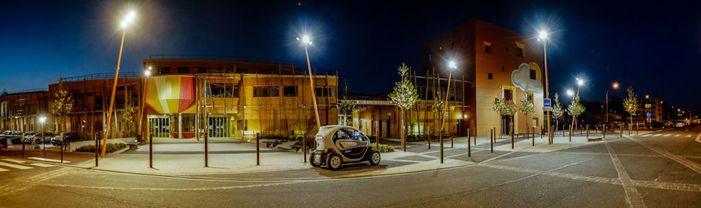 illuminated, night, building exterior, street light, architecture, built structure, transportation, street, lighting equipment, city, road, sky, light - natural phenomenon, land vehicle, mode of transport, city street, city life, car, outdoors, light trail