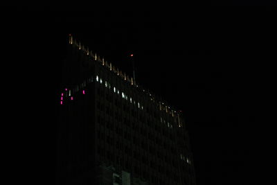 Low angle view of illuminated building at night