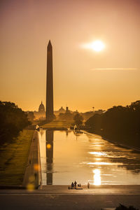 Bridge over river during sunset