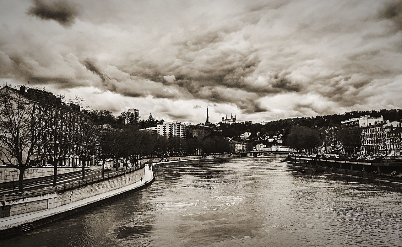 sky, water, cloud - sky, built structure, architecture, cloudy, building exterior, river, bridge - man made structure, weather, connection, overcast, cloud, waterfront, railing, the way forward, transportation, canal, storm cloud, outdoors