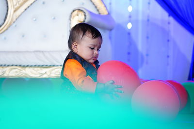 Cute boy playing with ball