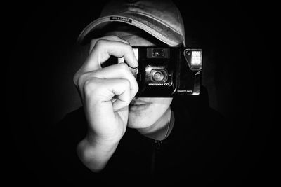 Close-up of hand holding camera