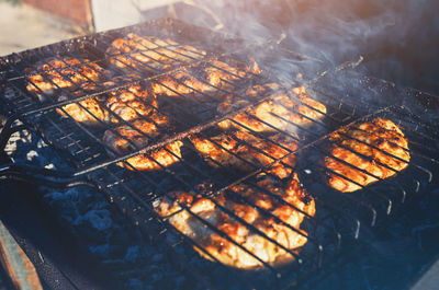 Up-close view of smoky grilled chicken, highlighting the beautiful grill marks