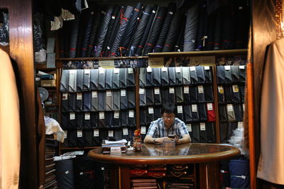 Man sitting on table at home