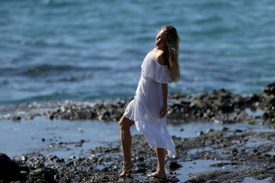 Woman standing at beach