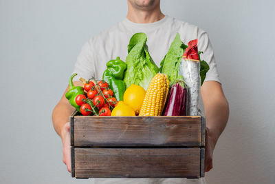 Midsection of woman holding food