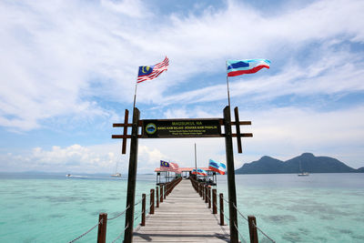 Scenic view of pier over sea against sky