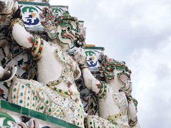 Low angle view of sculpture against sky