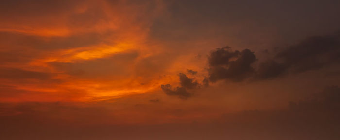 Low angle view of dramatic sky during sunset